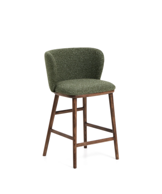 Tabouret Ciselia en chenille épaisse vert foncé et pieds en frêne massif finition noyer.